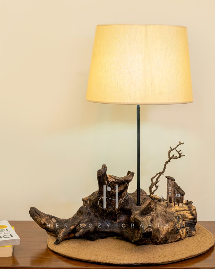 Darkwood Cove Lamp - Dark driftwood base with drum shade and village scene.