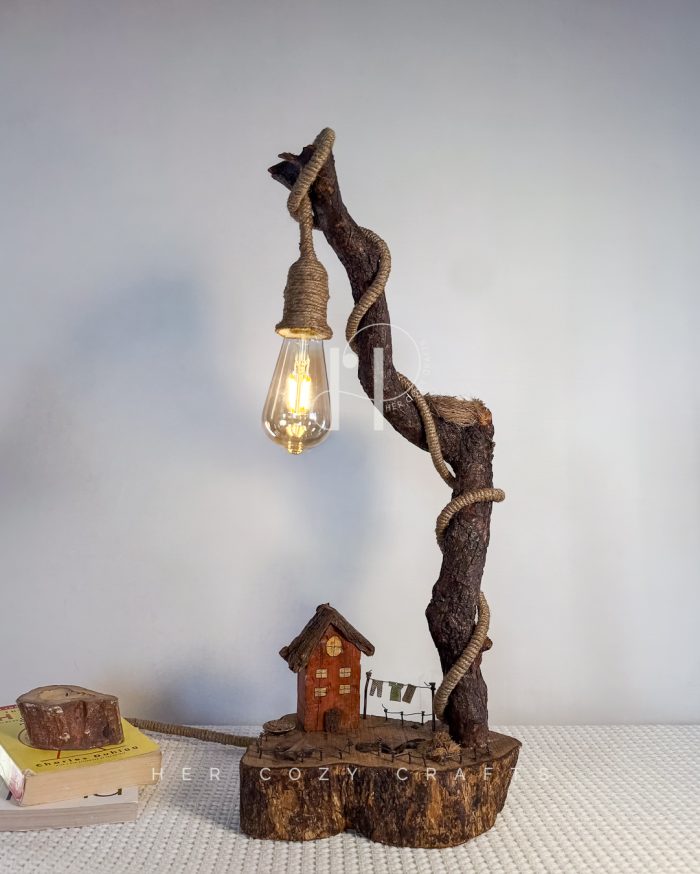 Homestead Curve Lamp - Angled stem over house, pins, and stone walkway